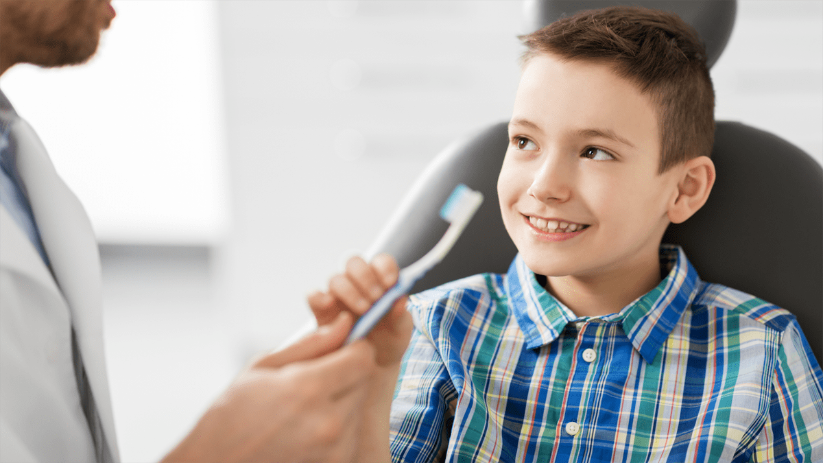 Child Holding tooth brush